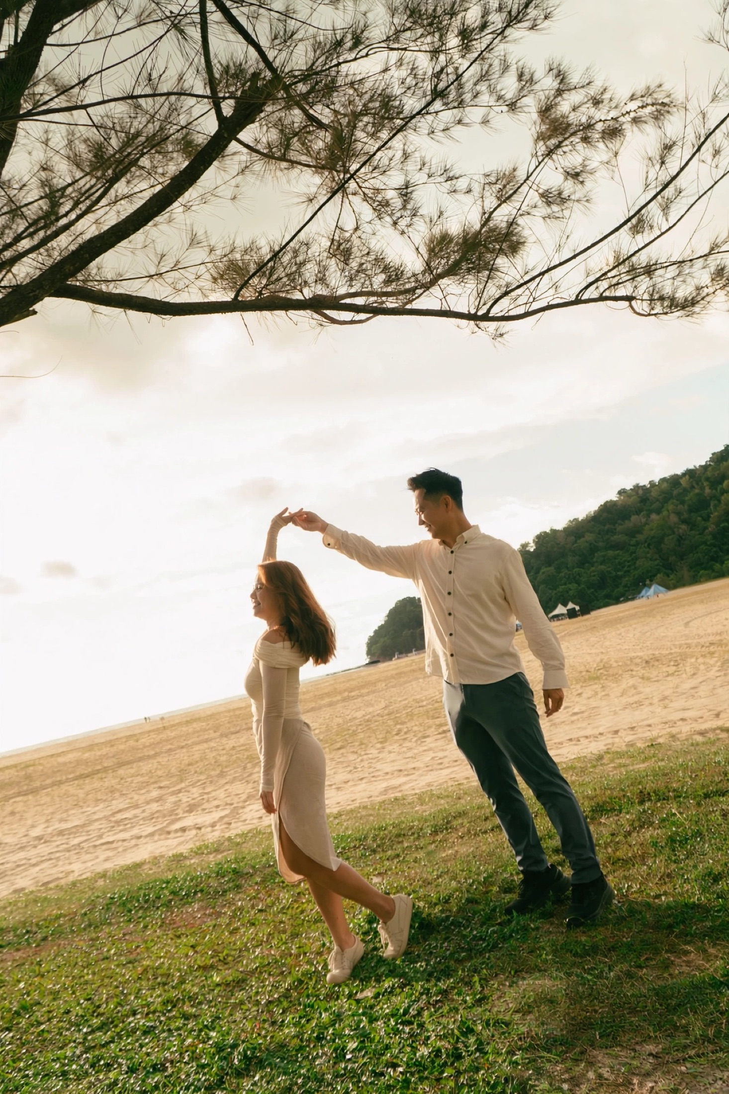 Phylicia twirling with Ian by the beach